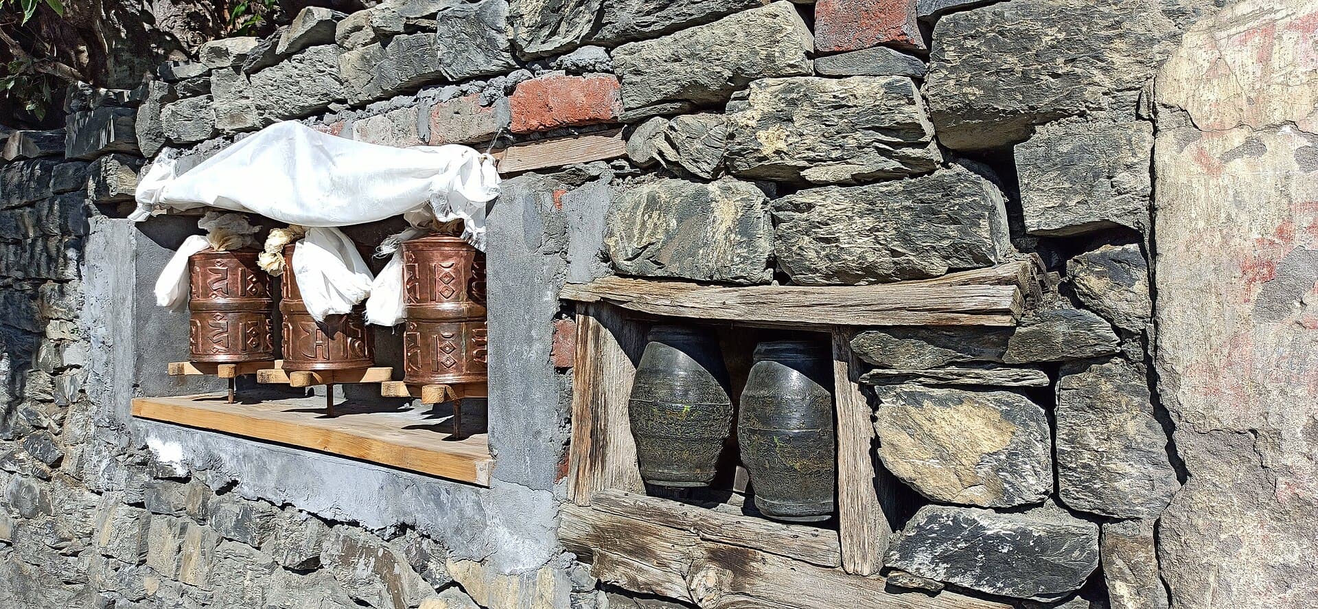 A wall of spinning prayer wheels