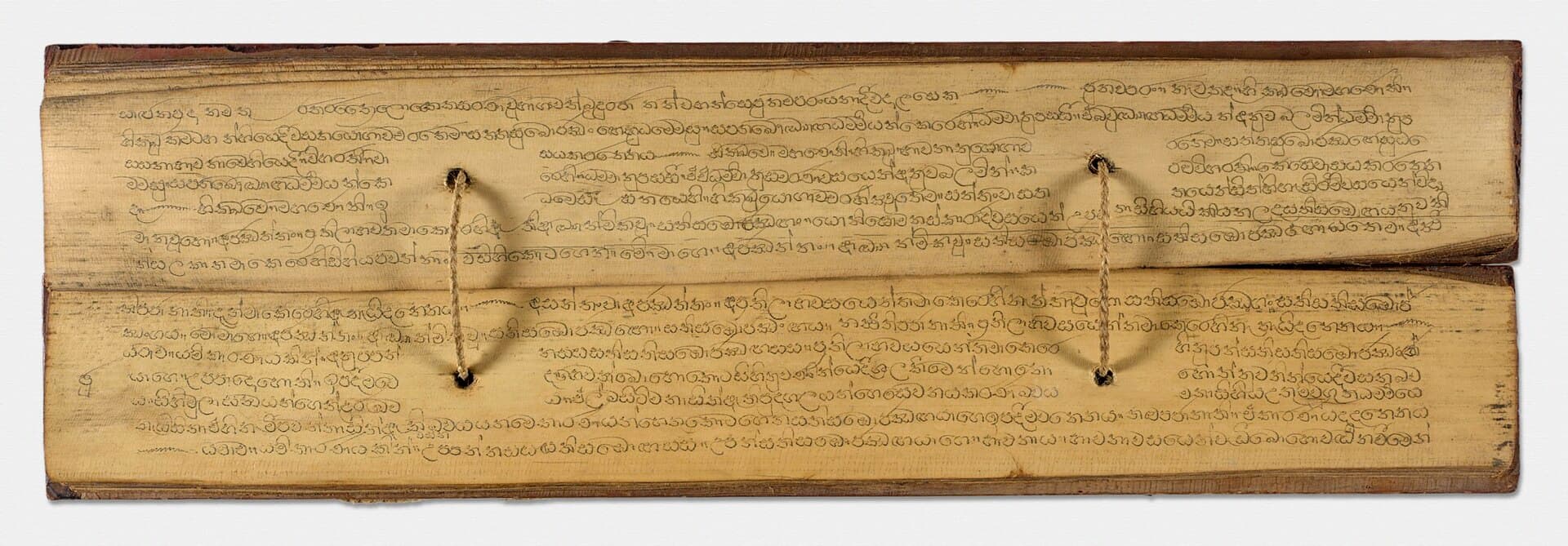 Sinhalese palm-leaf Buddhist manuscript bound with cord