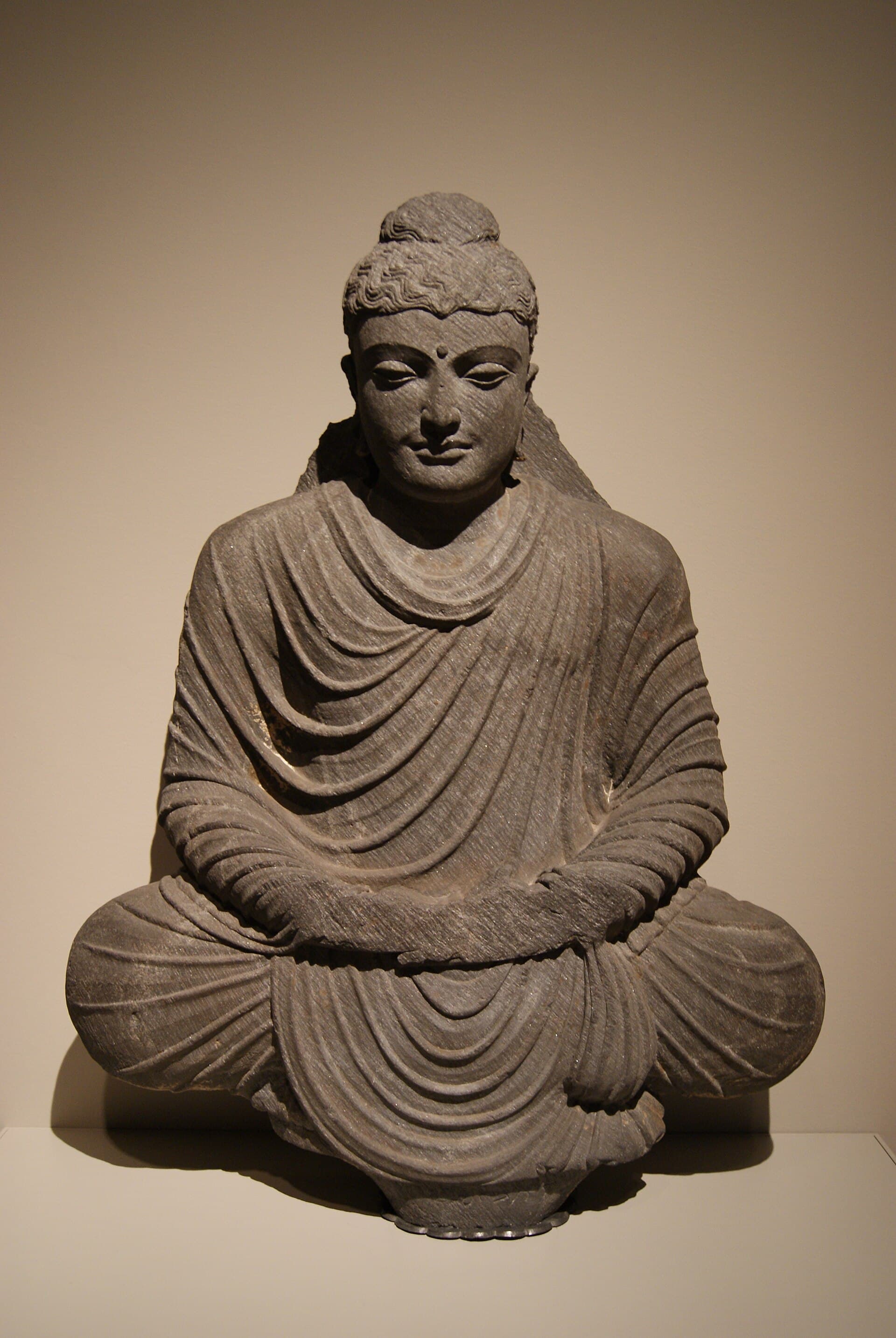 Gandharan stone sculpture of a seated Buddha in meditation, 3rd century