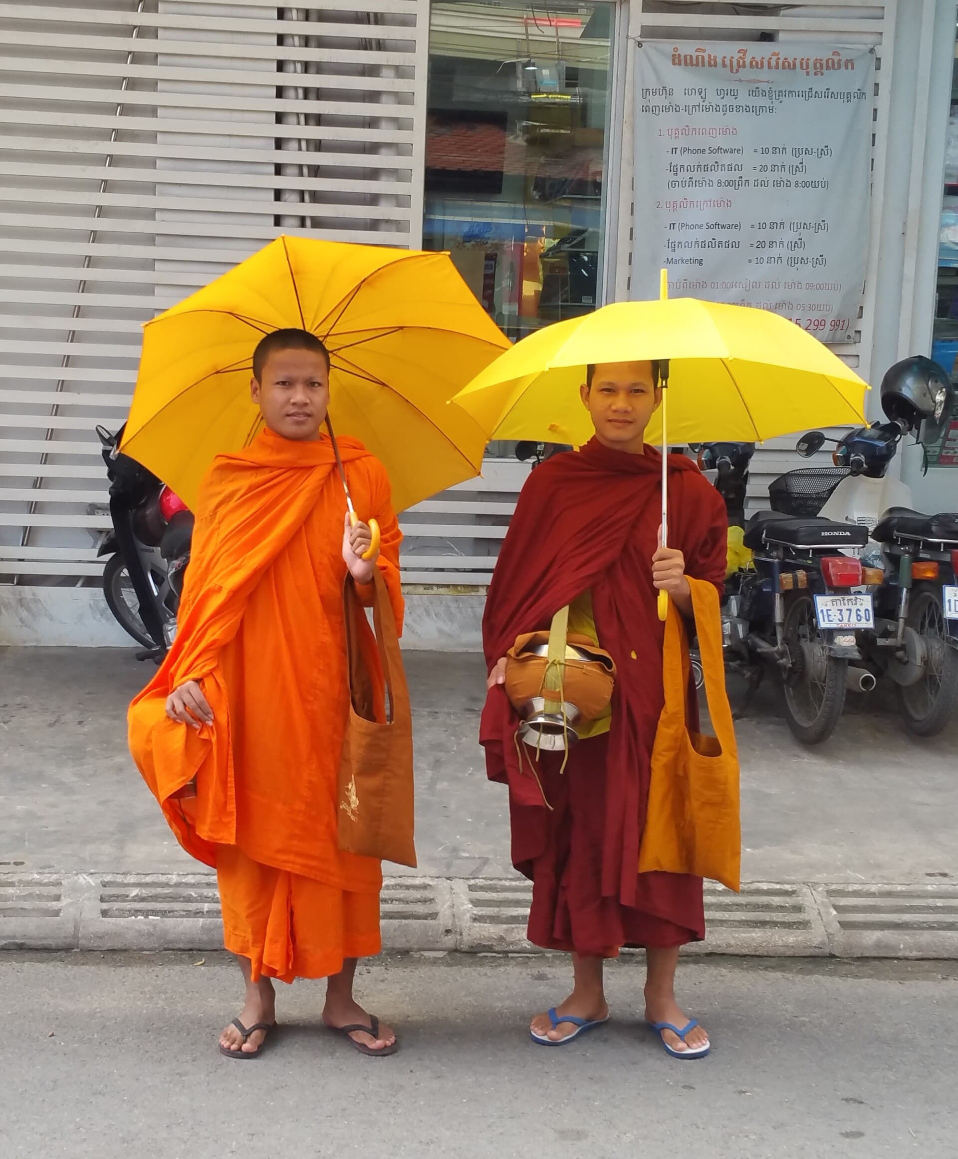 Monks on their morning alms round (pindacāra) carrying alms bowls