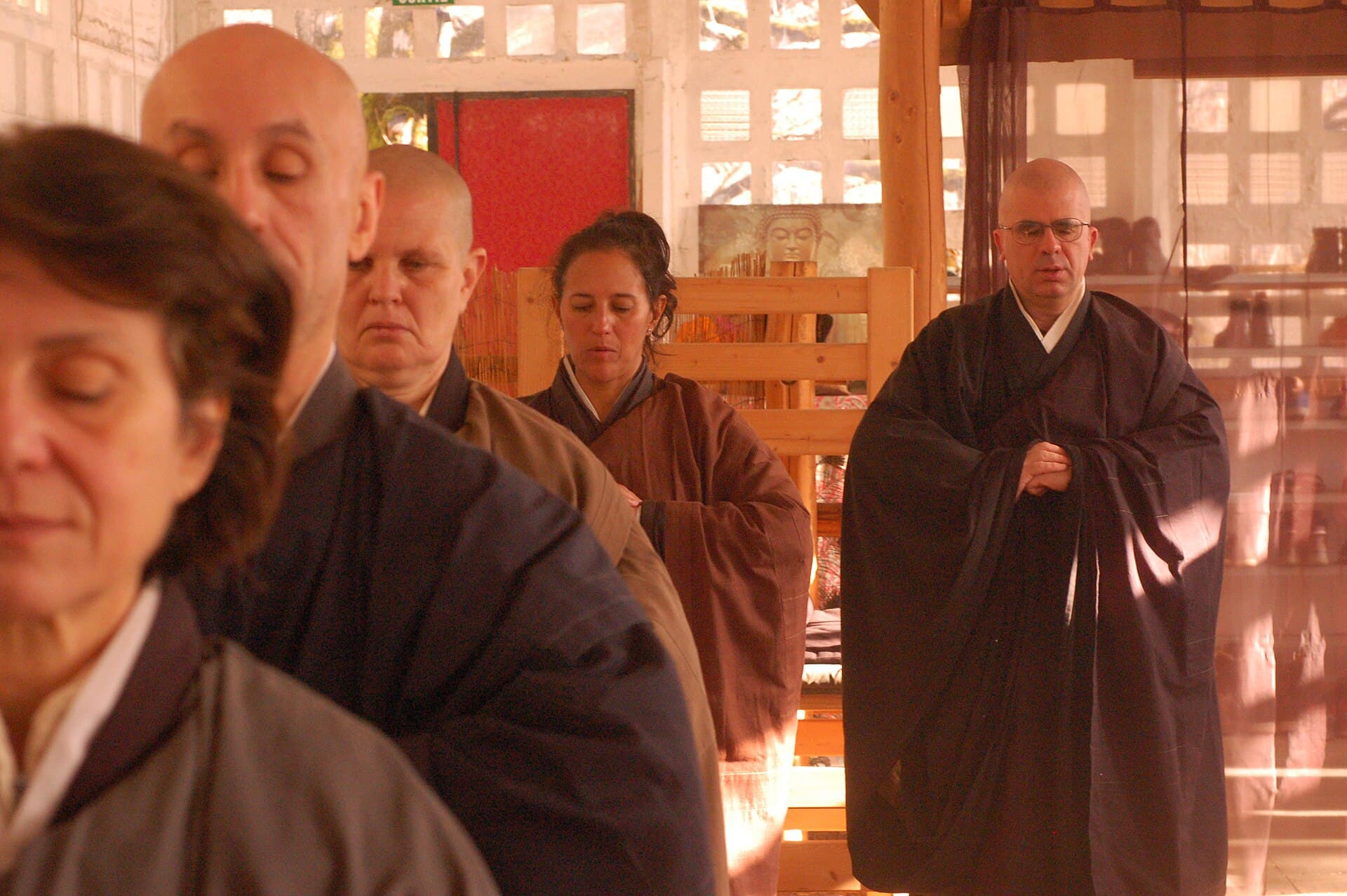 Zen practitioners performing kinhin, walking meditation, in single file
